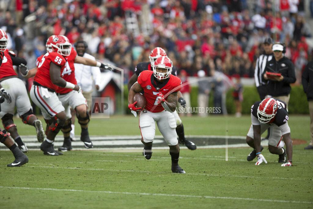 Jenn Finch Georgia running back D'Andre Swift (7) runs the ball in the first half of the NCAA football spring G-Day game at the University of Georgia in Athens, Ga., on Saturday, April 20, 2019. (Jenn Finch/Athens Banner-Herald via AP)
