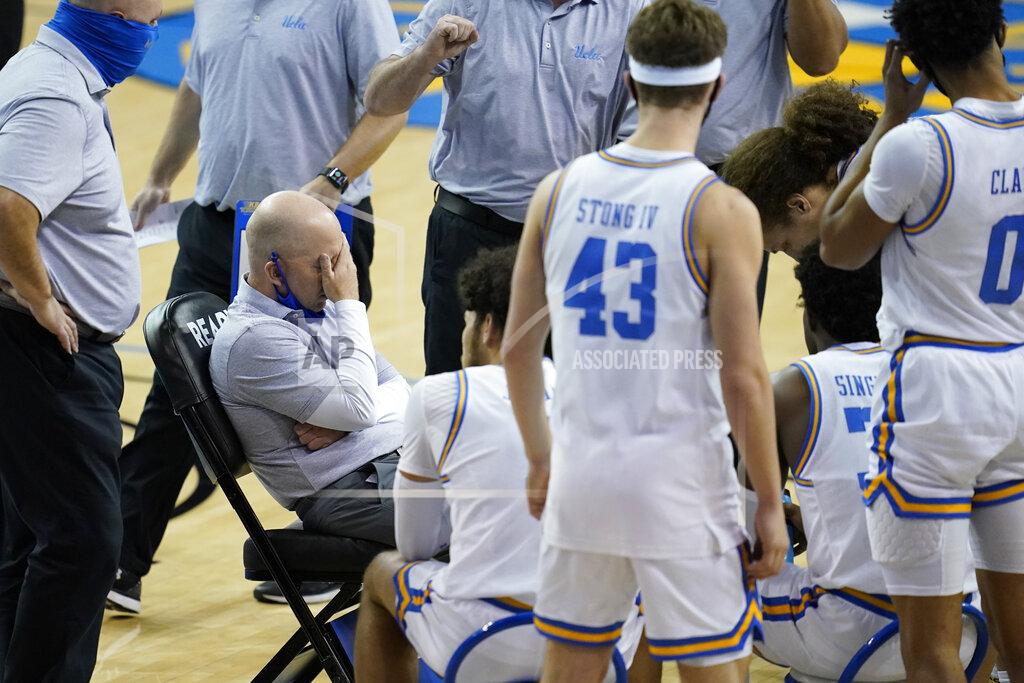 Ashley Landis UCLA coach Mick Cronin covers his face with his hand during a timeout in the first half of the team's NCAA college basketball game against Arizona State on Saturday, Feb. 20, 2021, in Los Angeles. (AP Photo/Ashley Landis)