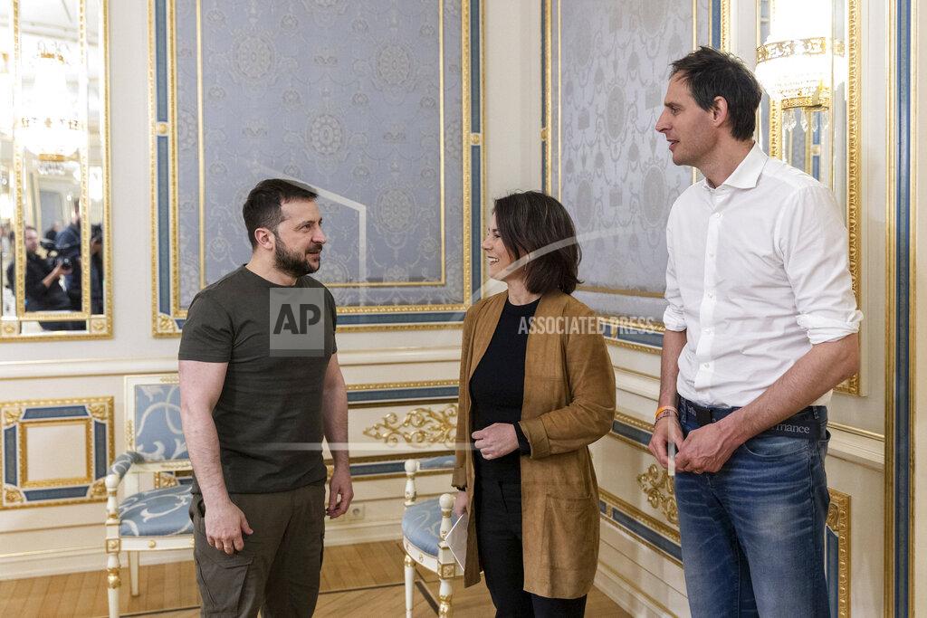 Uncredited In this handout photo provided by the Ukrainian Presidential Press Office, Ukrainian President Volodymyr Zelenskyy welcomes German Foreign Minister Annalena Baerbock and Dutch Foreign Minister Wopke Hoekstra in Kyiv, Ukraine, Tuesday, May 10, 2022. (Ukrainian Presidential Press Office via AP)