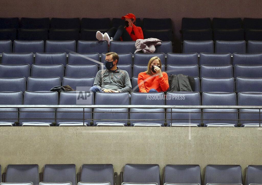 Andrew Shurtleff A few fans watch Virginia play St. Francis during an NCAA college basketball game Tuesday, Dec. 1, 2020, in Charlottesville, Va. (Andrew Shurtleff/The Daily Progress via AP)