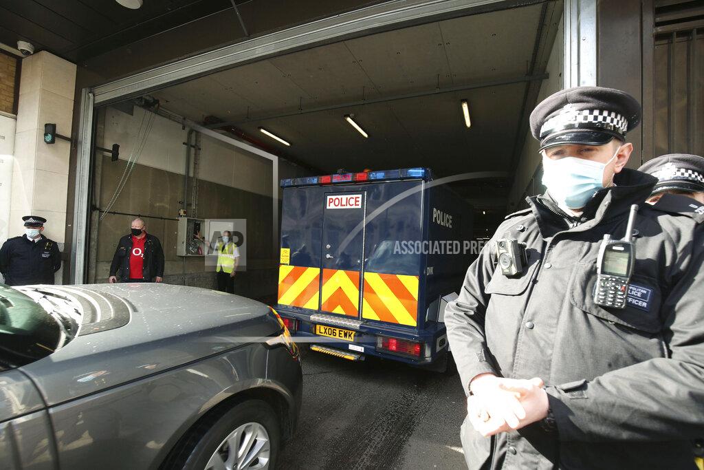 Steve Parsons A police van arrives at Westminster Magistrates' Court, in London, Saturday March 13, 2021. London police arrested a member of the force's Parliamentary and Diplomatic Protection Command on Tuesday as a suspect in the case of the disappearance of Sarah Everard. Late Friday police charged the officer, Constable Wayne Couzens, with kidnapping and murder. Couzens, 48, was due to appear in court on Saturday. (Steve Parsons/PA via AP)
