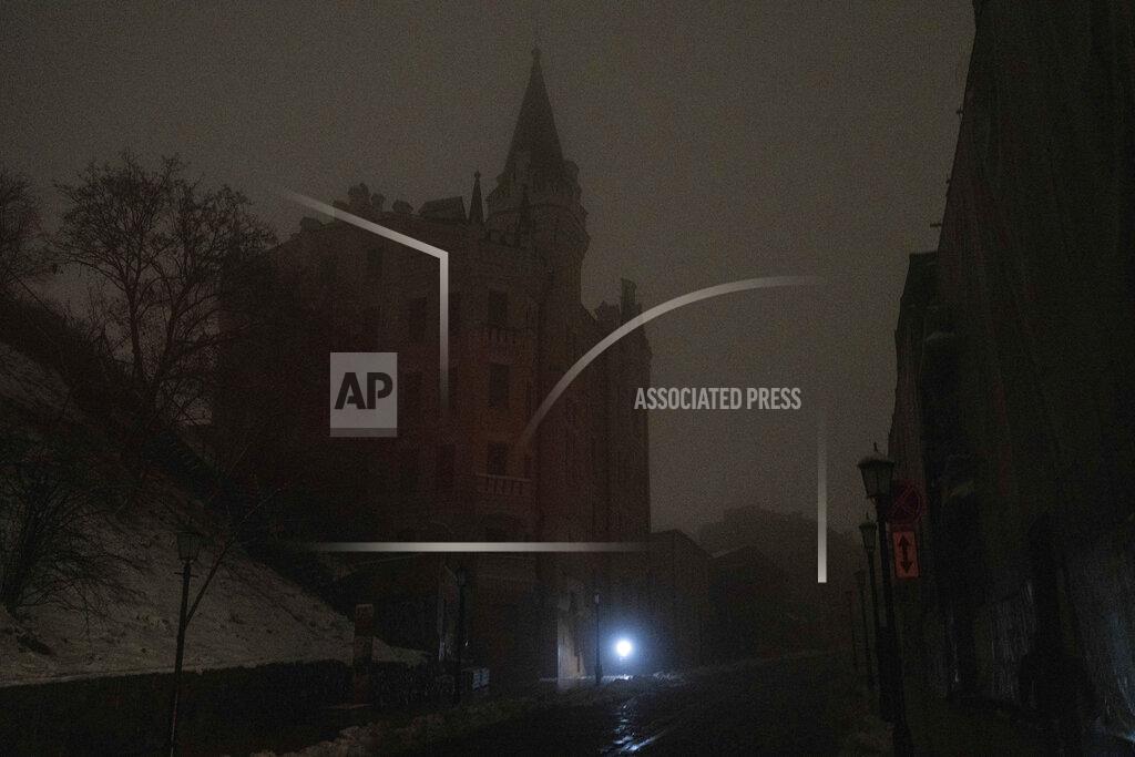 Evgeniy Maloletka A man walks at the city center which lost electrical power after yesterday's Russian rocket attack in Kyiv, Ukraine, Thursday, Nov. 24, 2022. (AP Photo/Evgeniy Maloletka)