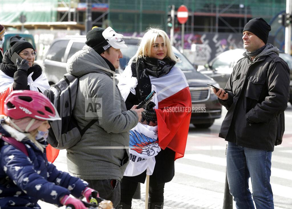 Czarek Sokolowski FILE - In this Saturday, March 20, 2021 file photo, opponents of the nationwide anti-COVID-19 lockdown protest the measure, in Warsaw, Poland. Poland has recorded a record high number of new daily coronavirus infections for the second day in a row. The 34,000 new cases on Thursday, March 25, 2021 are more than 4,000 more than the record reported a day earlier. Meanwhile, The bleak numbers come as the prime minister prepares to give details of harsher restrictions for the Easter period. Across much of central Europe, vaccine rollouts are are happening too slowly to hold back the new surge. (AP Photo/Czarek Sokolowski, File)