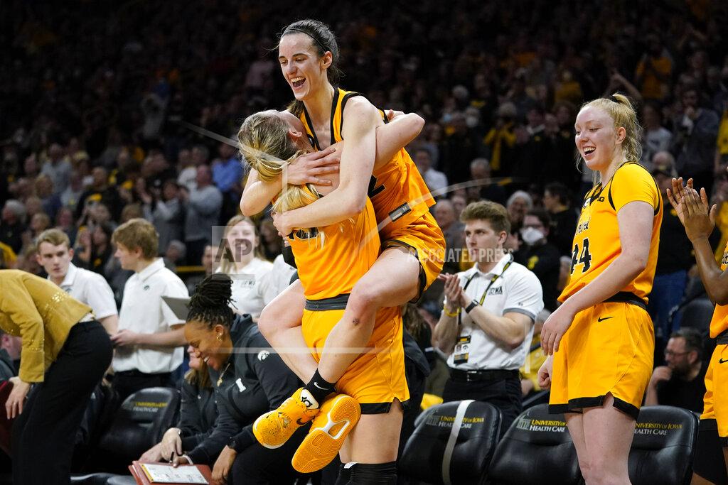 Charlie Neibergall Iowa forward Monika Czinano, left, celebrates with teammate Caitlin Clark at the end of an NCAA college basketball game against Michigan, Sunday, Feb. 27, 2022, in Iowa City, Iowa. Iowa won 104-80. The victory gave Iowa a share of the Big Ten Conference championship. (AP Photo/Charlie Neibergall)