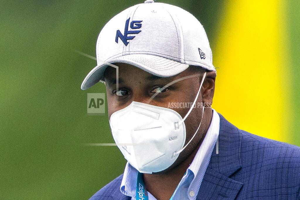 Doug Murray FILE - Miami Dolphins General Manager Chris Grier wear a mask on the sideline before the Dolphins take on the New England Patriots in an NFL football game in Miami Gardens, Fla., in this Sunday, Dec. 20, 2020, file photo. Miami Dolphins general manager Chris Grier gave rookie Tua Tagovailoa a strong endorsement Tuesday, Jan. 5, 2020, which may tamp down speculation about the team’s draft plans. Or not. (AP Photo/Doug Murray, File)