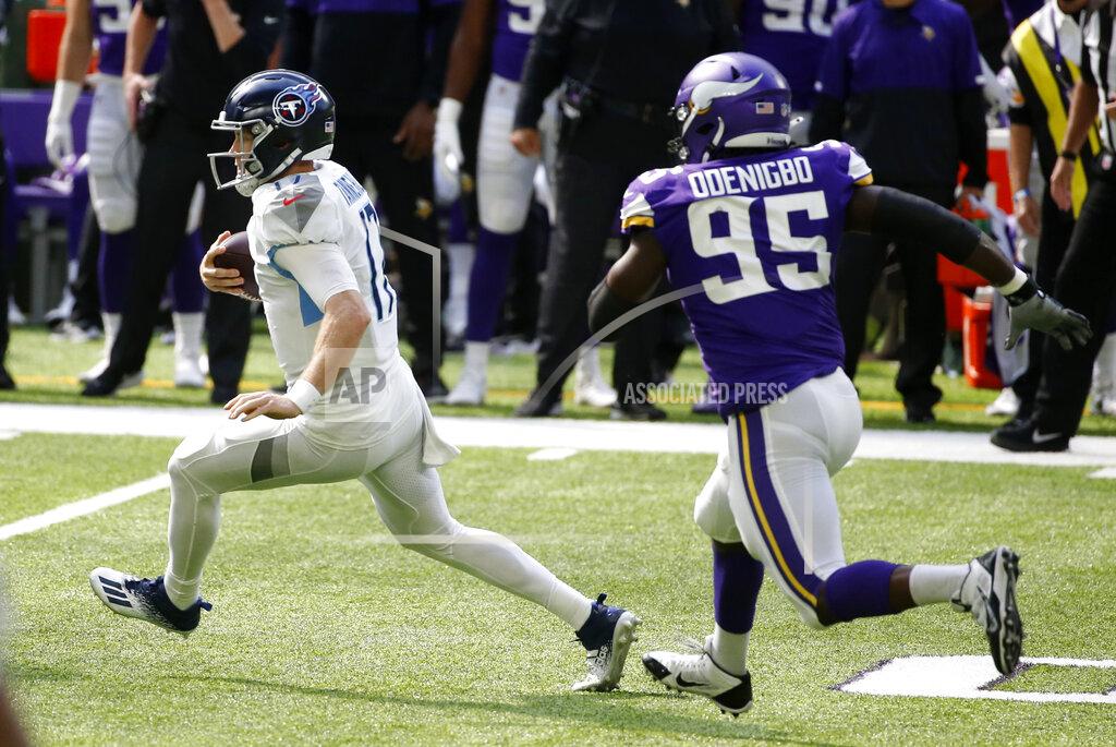 Bruce Kluckhohn Tennessee Titans quarterback Ryan Tannehill runs from Minnesota Vikings defensive end Ifeadi Odenigbo (95) during the first half of an NFL football game, Sunday, Sept. 27, 2020, in Minneapolis. (AP Photo/Bruce Kluckhohn)