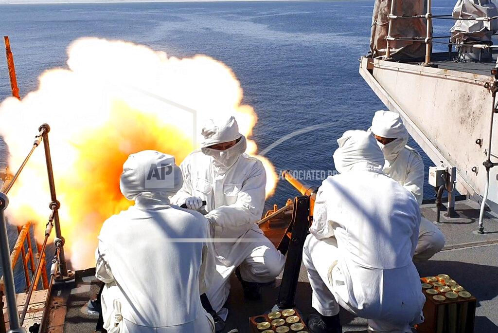 Jay Allen This handout photo provided by the Ministry of Defense shows crew members of the HMS Montrose firing a 41-round gun salute to to mark the death of the Duke of Edinburgh, in Duqm, Oman. Britain's Prince Philip, the irascible and tough-minded husband of Queen Elizabeth II who spent more than seven decades supporting his wife in a role that mostly defined his life, died on Friday. (Jay Allen/Ministry of Defense via AP)