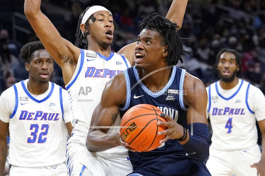 Nam Y. Huh Villanova forward Brandon Slater, second from right, drives to the basket against DePaul forward Javan Johnson during the first half of an NCAA college basketball game in Chicago, Saturday, Jan. 8, 2022. (AP Photo/Nam Y. Huh)