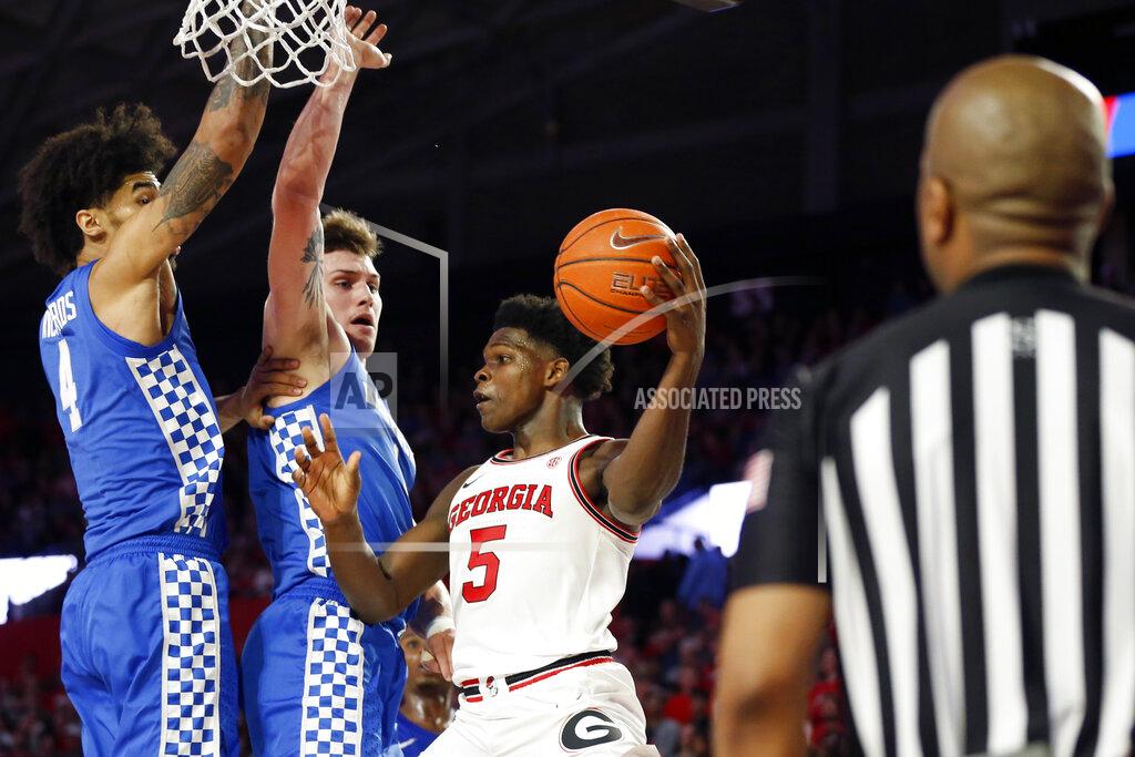 Joshua L. Jones Kentucky forwards Nick Richards (4) and Nate Sestina (1) is defend against Georgia's Anthony Edwards (5) during an NCAA college basketball game Tuesday, Jan. 7, 2020, in Athens, Ga. (Joshua L. Jones/Athens Banner-Herald via AP)