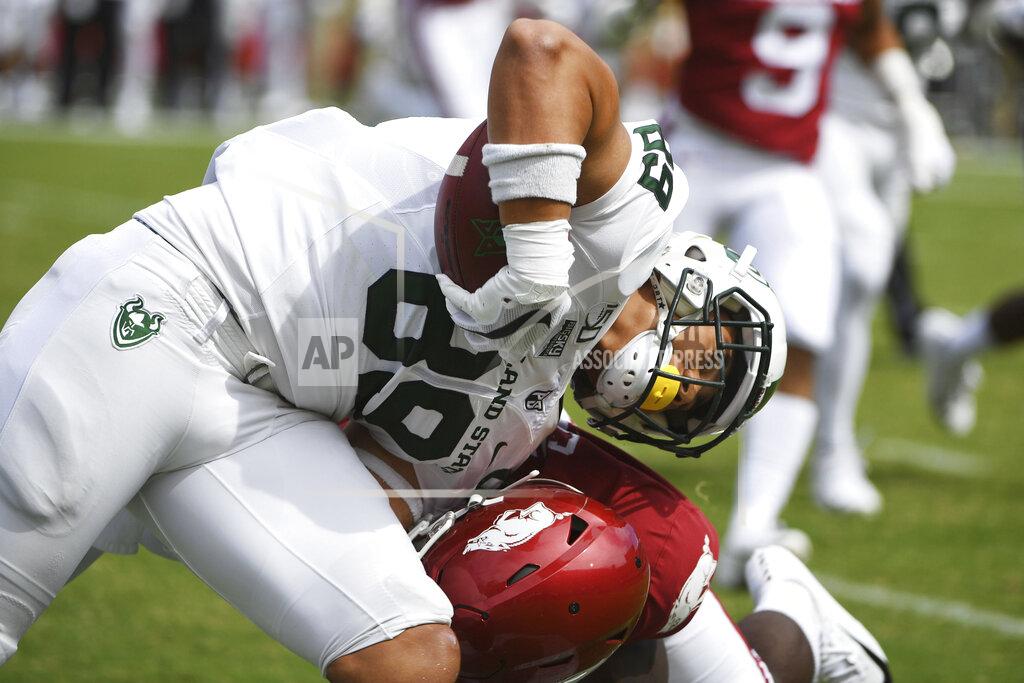 Michael Woods Portland State tight end Charlie Taumoepeau is taken down by an Arkansas defender in the first half of an NCAA college football game, Saturday, Aug. 31, 2019 in Fayetteville, Ark. (AP Photo/Michael Woods)
