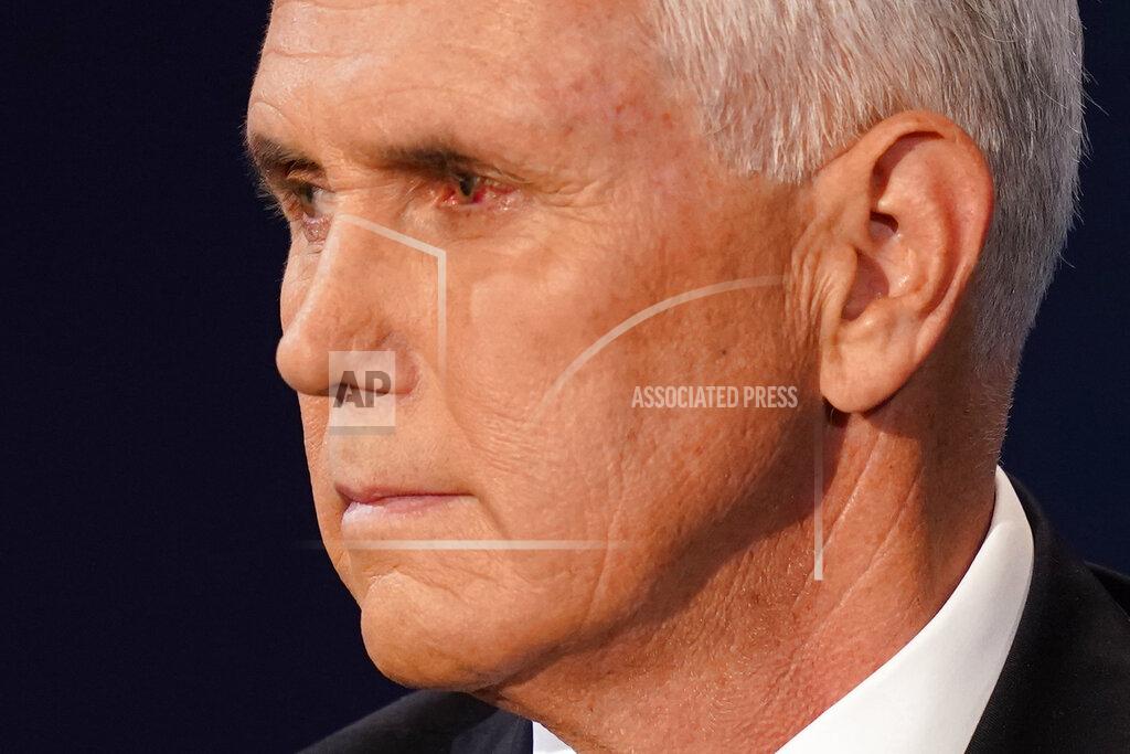 Vice President Mike Pence looks at Democratic vice presidential candidate Sen. Kamala Harris, D-Calif., during the vice presidential debate Wednesday, Oct. 7, 2020, at Kingsbury Hall on the campus of the University of Utah in Salt Lake City. (AP Photo/Patrick Semansky)