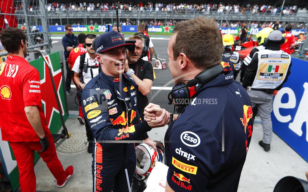 Eduardo Verdugo Red Bull driver Max Verstappen, of the Netherlands, celebrates his pole position with a members of his team during the qualifying session of the Formula One Mexico Grand Prix auto race at the Hermanos Rodriguez racetrack in Mexico City, Saturday, Oct. 26, 2019. (AP Photo/Eduardo Verdugo)
