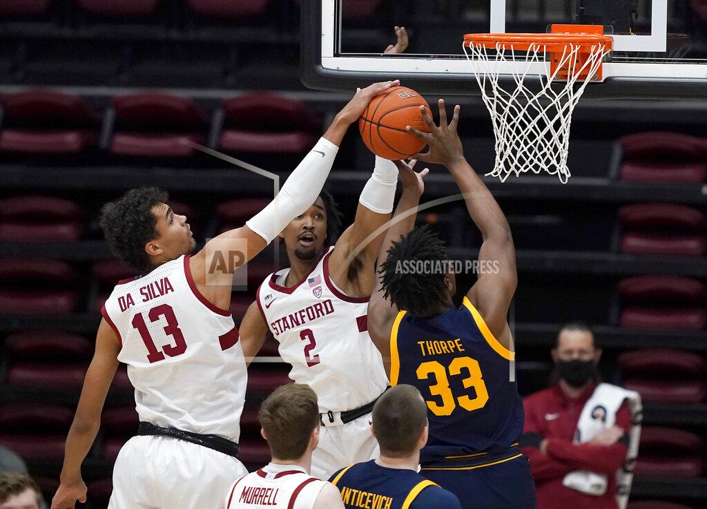 Tony Avelar Stanford forward Oscar da Silva (13) blocks California forward D.J. Thorpe (33) during the first half of an NCAA college basketball game in Stanford, Calif., Sunday, Feb. 7, 2021. (AP Photo/Tony Avelar)