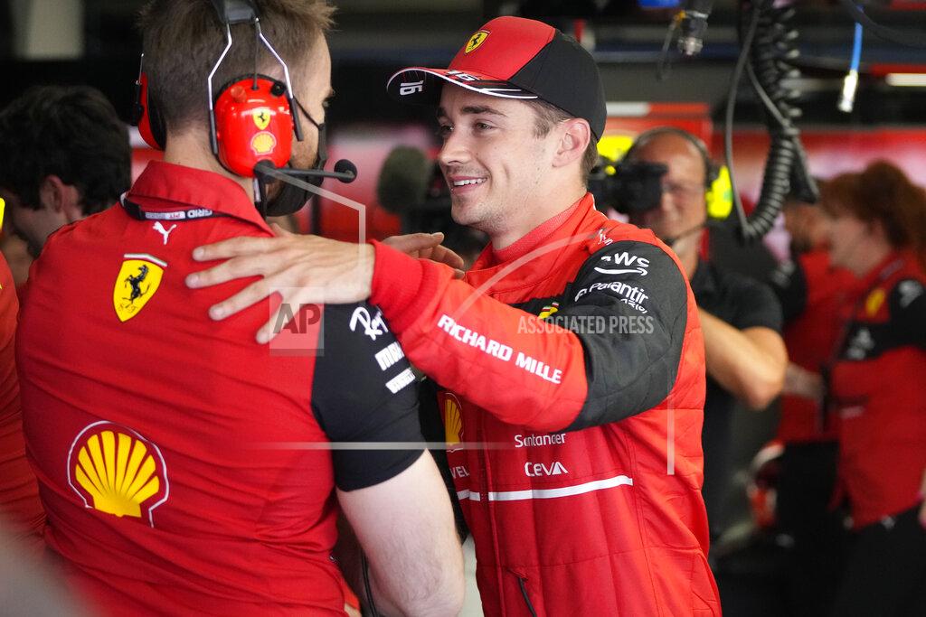 Manu Fernandez Ferrari driver Charles Leclerc of Monaco celebrates after setting the pole position in the qualifying session at the Barcelona Catalunya racetrack in Montmelo, Spain, Saturday, May 21, 2022. The Formula One race will be held on Sunday. (AP Photo/Manu Fernandez)
