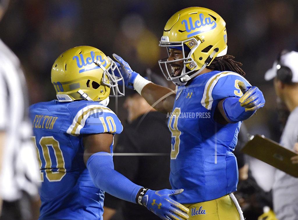 Mark J. Terrill UCLA wide receiver Demetric Felton, left, celebrates with UCLA wide receiver Dymond Lee in the final seconds of an NCAA college football game against Arizona Saturday, Oct. 20, 2018, in Pasadena, Calif. UCLA won 31-30. (AP Photo/Mark J. Terrill)