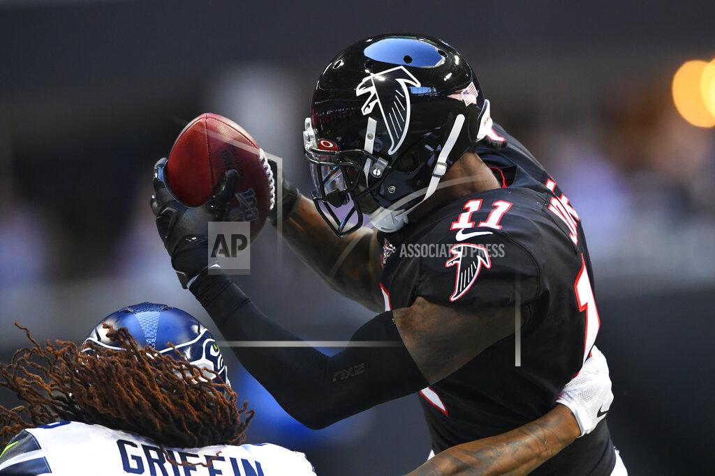 John Amis Atlanta Falcons wide receiver Julio Jones (11) works to make the catch Seattle Seahawks outside linebacker Shaquem Griffin (49) during the first half of an NFL football game, Sunday, Oct. 27, 2019, in Atlanta. (AP Photo/John Amis)