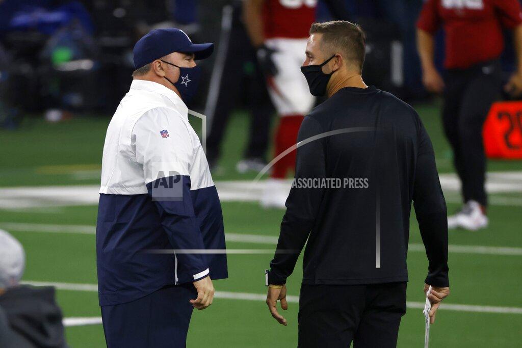 Ron Jenkins Dallas Cowboys head coach Mike McCarthy, left, and Arizona Cardinals head coach Kliff Kingsbury, right, greet each other on the field during warmups before an NFL football game in Arlington, Texas, Monday, Oct. 19, 2020. (AP Photo/Ron Jenkins)