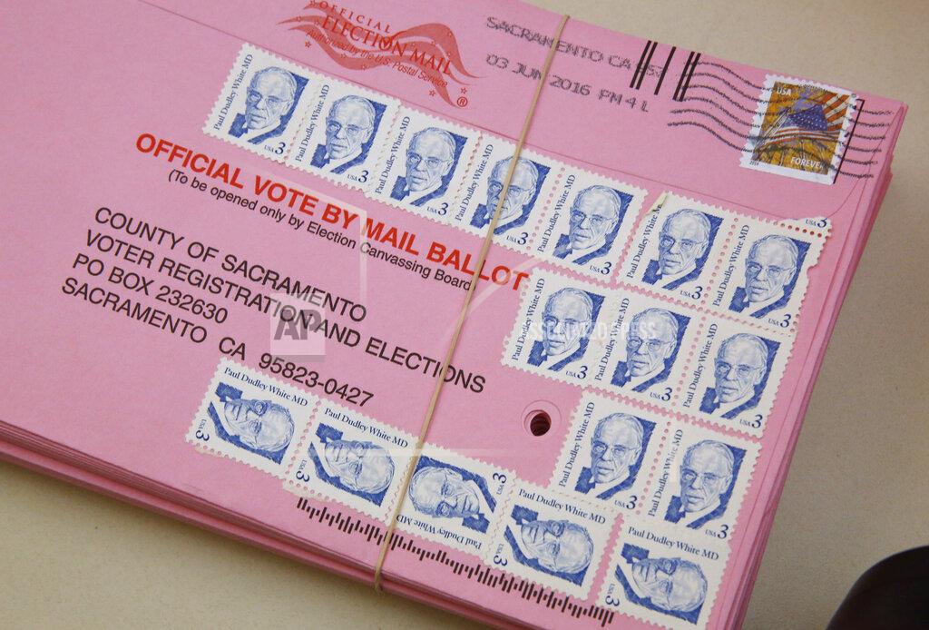 Rich Pedroncelli FILE - This Friday, June 10, 2016 file photo shows a mail-in ballot yet to be counted at the Sacramento County Registrar of Voters office, in Sacramento, Calif. Over 100,000 mail-in ballots were rejected by election officials in California's March 2020 presidential primary, highlighting a glaring gap in the effort to ensure every vote is counted as a national dispute rages over the integrity of vote-by-mail elections. (AP Photo/Rich Pedroncelli, File)