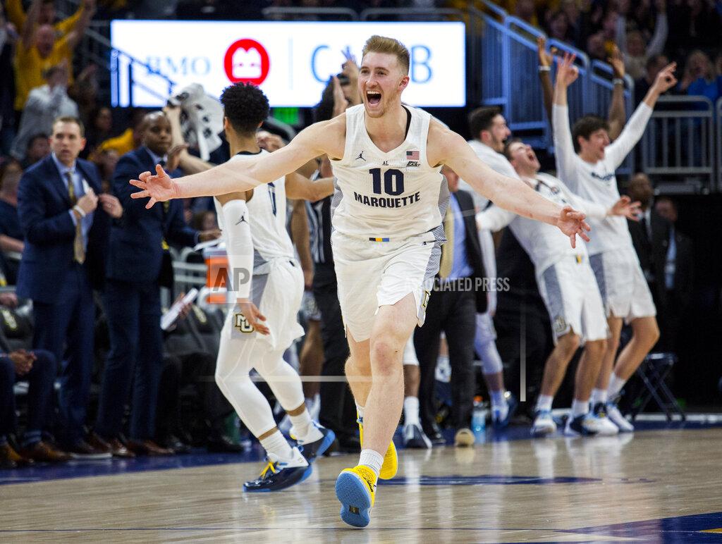 Marquette forward Sam Hauser reacts after making a three-point basket against Providence late in the second half of an NCAA college basketball game Sunday, Jan. 20, 2019, in Milwaukee. (AP Photo/Darren Hauck)
