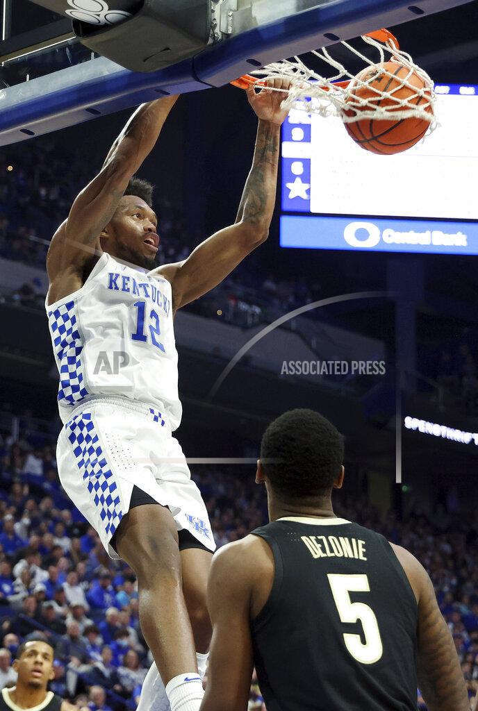 James Crisp Kentucky's Keion Brooks Jr. (12) dunks in front of Vanderbilt's Shane Dezonie (5) during the first half of an NCAA college basketball game in Lexington, Ky., Wednesday, Feb. 2, 2022. (AP Photo/James Crisp)