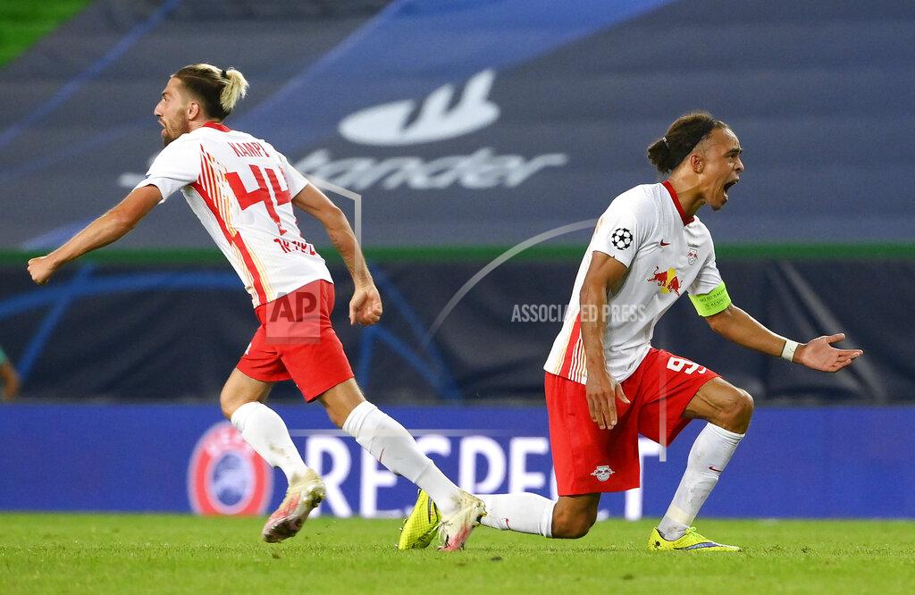 Lluis Gene Leipzig's Yussuf Poulsen, right, and teammate Kevin Kampl celebrate after their team's Champions League quarterfinal win over Atletico Madrid at the Jose Alvalade stadium in Lisbon, Portugal, Thursday, Aug. 13, 2020. (Lluis Gene/Pool Photo via AP)