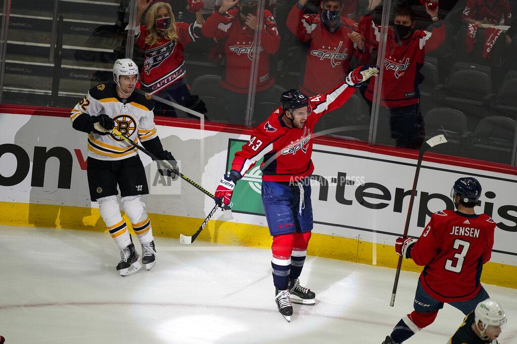 Alex Brandon Washington Capitals right wing Tom Wilson (43) celebrates his goal during the first period of Game 1 of an NHL hockey Stanley Cup first-round playoff series against the Boston Bruins, Saturday, May 15, 2021, in Washington. (AP Photo/Alex Brandon)
