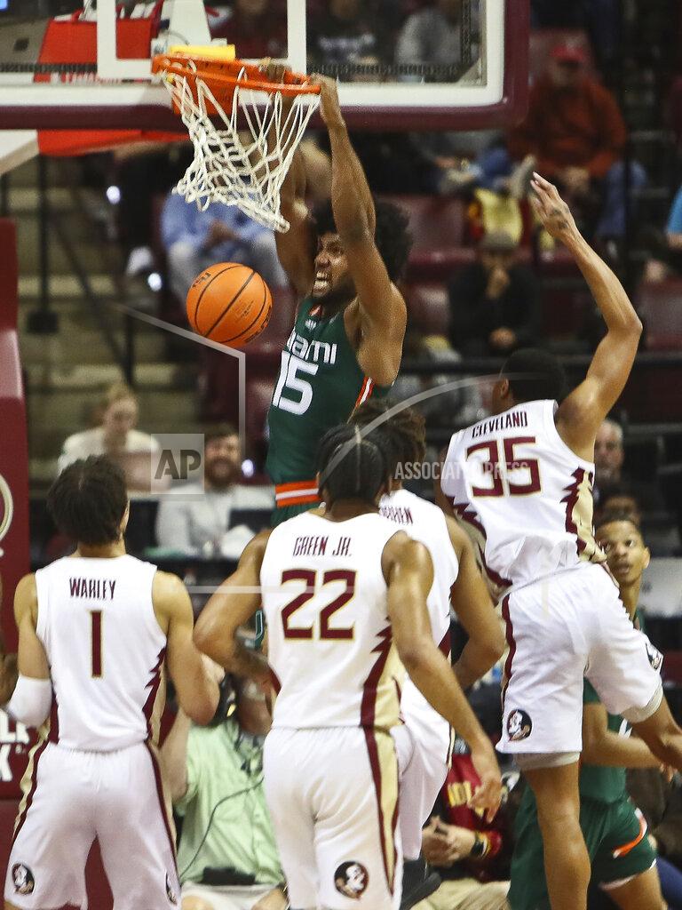 Phil Sears Miami forward Norchad Omier (15) dunks in the first half of an NCAA college basketball game against Florida State in Tallahassee, Fla., Tuesday, Jan. 24, 2023. (AP Photo/Phil Sears)