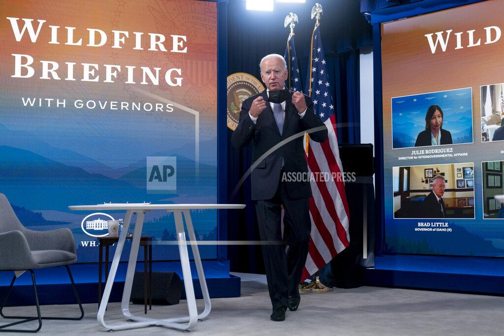 Andrew Harnik President Joe Biden arrives for a meeting with governors to discuss ongoing efforts to strengthen wildfire prevention, preparedness and response efforts, and hear firsthand about the ongoing impacts of the 2021 wildfire season in the South Court Auditorium in the Eisenhower Executive Office Building on the White House Campus in Washington, Friday, July 30, 2021. (AP Photo/Andrew Harnik)