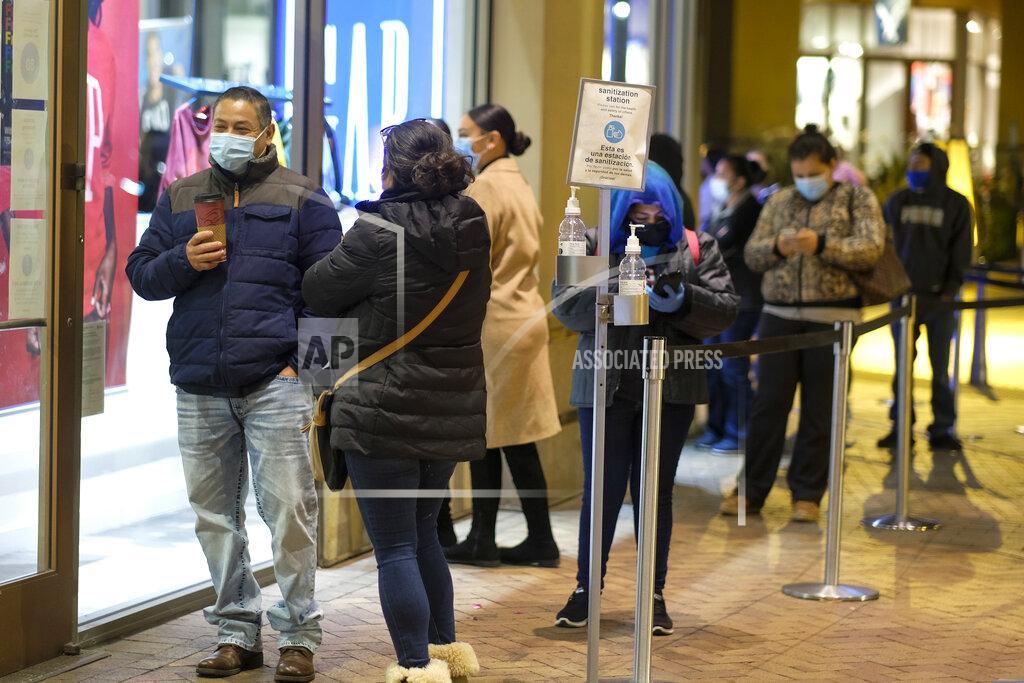 Ringo H.w. Chiu Black Friday shoppers wait in line to enter an shore that opened at 6am at the Citadel Outlets in Commerce, Calif., Friday, Nov. 27, 2020. (AP Photo/Ringo H.W. Chiu)