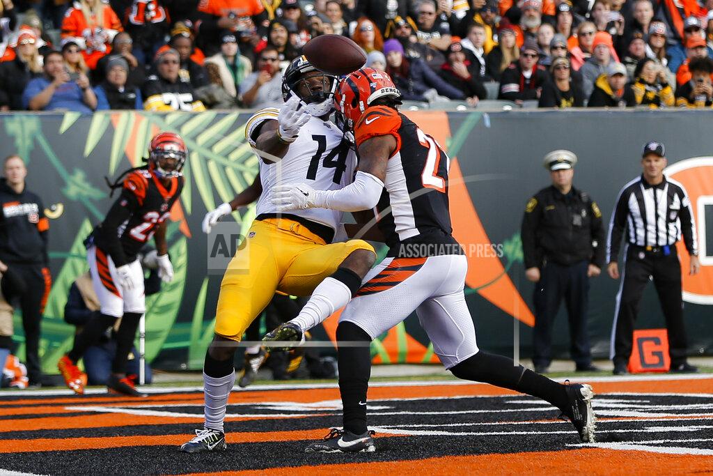 Frank Victores Pittsburgh Steelers wide receiver Tevin Jones (14) misses a pass against Cincinnati Bengals defensive back Darqueze Dennard, right, during the first half an NFL football game, Sunday, Nov. 24, 2019, in Cincinnati. (AP Photo/Frank Victores)