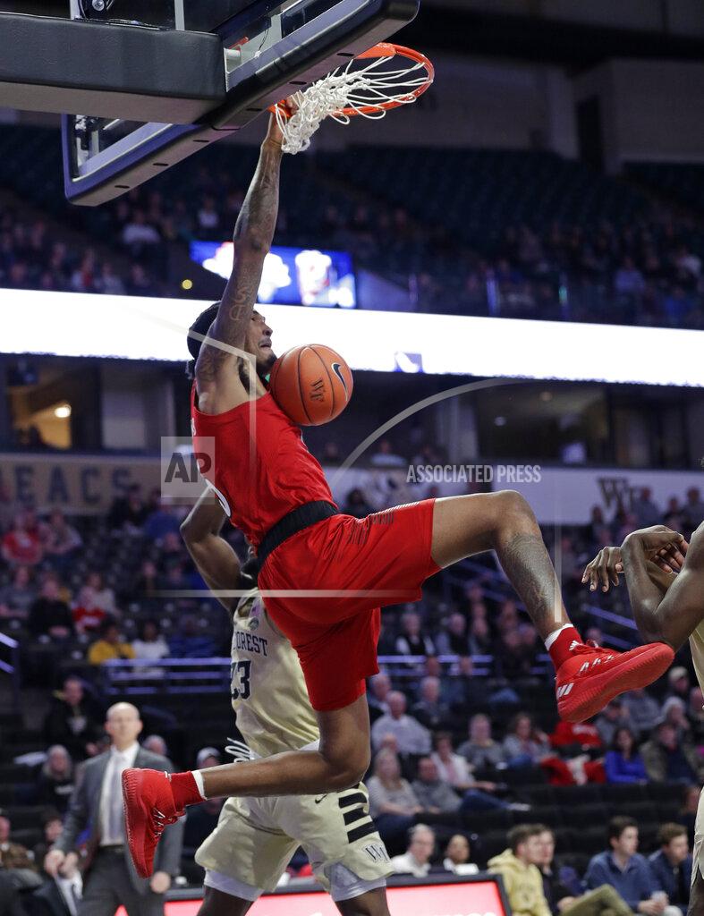 Chuck Burton Louisville's Malik Williams (5) dunks next to Wake Forest's Chaundee Brown (23) during the second half of an NCAA college basketball game in Winston-Salem, N.C., Wednesday, Jan. 30, 2019. (AP Photo/Chuck Burton)