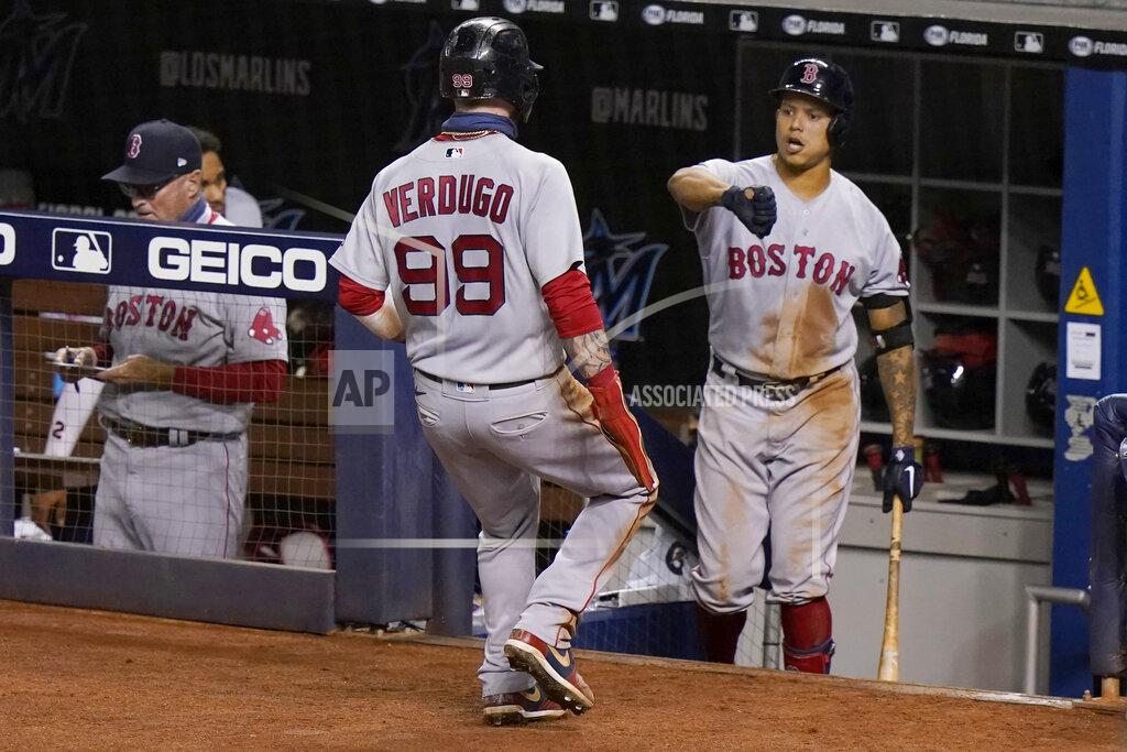 Lynne Sladky Boston Red Sox's Alex Verdugo (99) is greeted by Yairo Munoz, right, after scoring on a sacrifice fly by J.D. Martinez during the third inning of a baseball game against the Miami Marlins, Wednesday, Sept. 16, 2020, in Miami. (AP Photo/Lynne Sladky)
