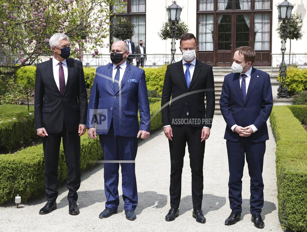 Czarek Sokolowski Slovak Foreign Minister Ivan Korcok, left,Polish Foreign Minister Zbigniew Rau, Hungarian Foreign Minister Peter Szijjarto and Czech Republic Foreign Minister Tomas Petricek,right, pose after meeting the foreign ministers of the Visegrad Group ,V4, in Lodz, Poland, Friday, May 14, 2021.(AP Photo/Czarek Sokolowski)