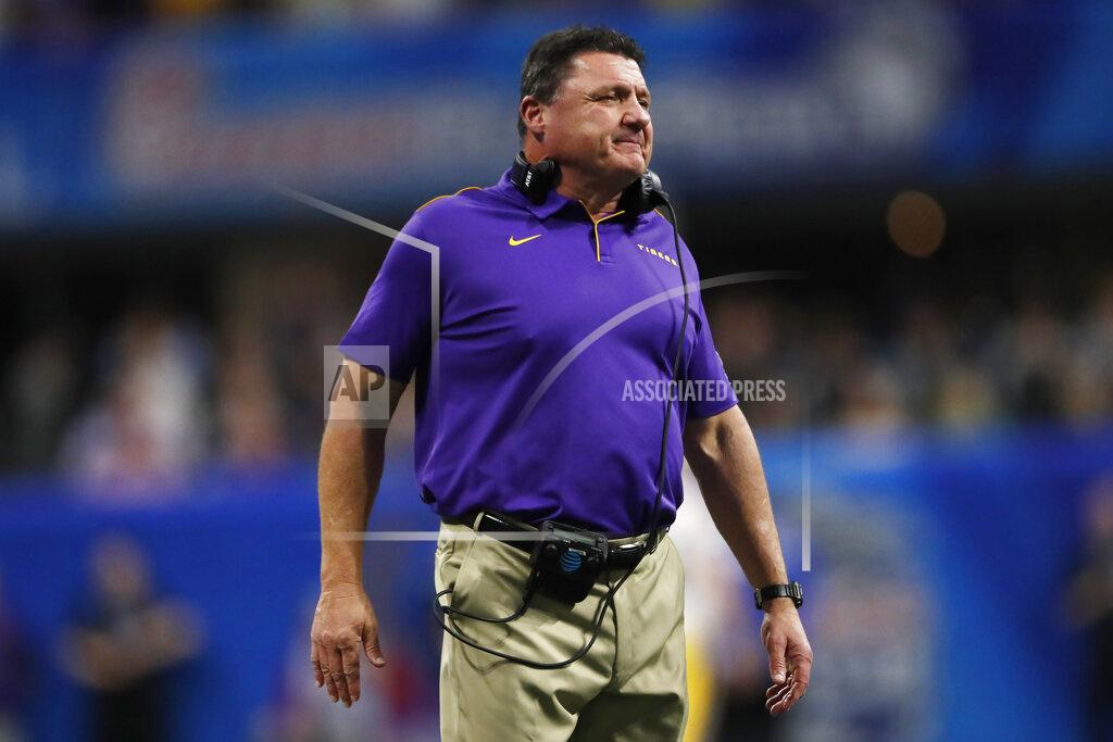 LSU coach Ed Orgeron waits for players during the first half of the Peach Bowl NCAA semifinal college football playoff game against Oklahoma, Saturday, Dec. 28, 2019, in Atlanta. (AP Photo/John Bazemore)
