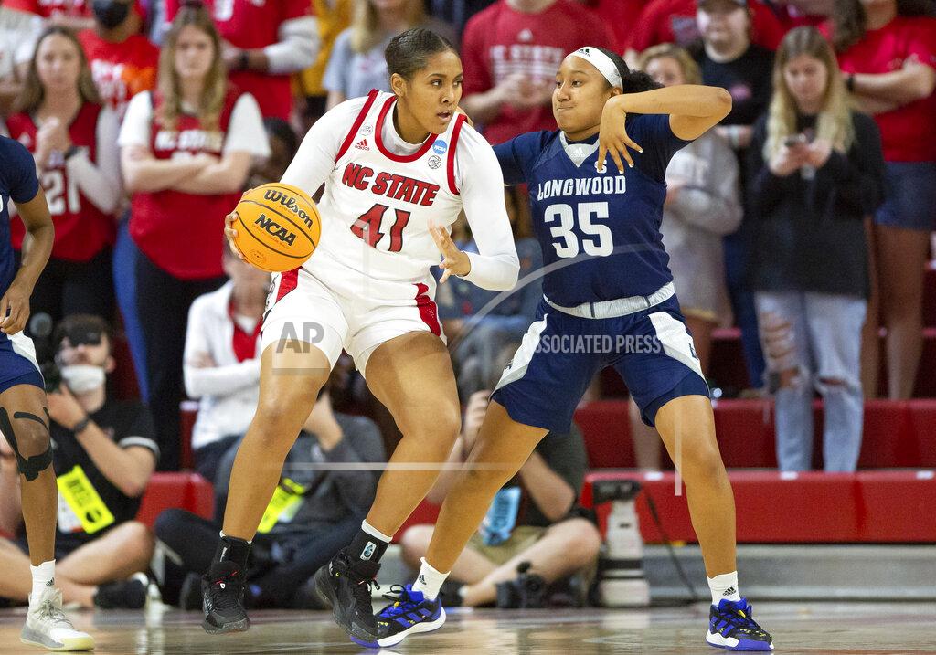 Ben Mckeown North Carolina State's Camille Hobby (41) backs into Longwood's Bri Johns (35) during the first half of a college basketball game in the first round of the NCAA tournament in Raleigh, N.C., Saturday, March 19, 2022. (AP Photo/Ben McKeown)