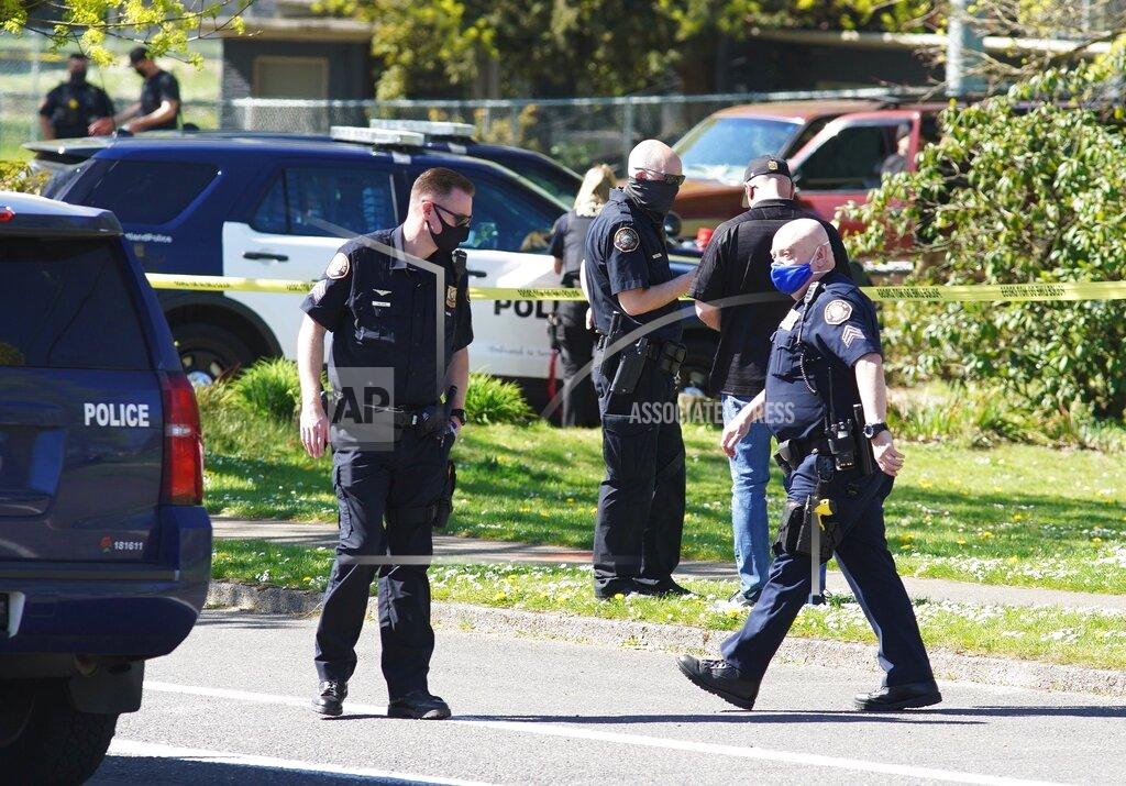 Mark Graves FILE - In this Friday, April 16, 2021, file photo, law enforcement personnel work at the scene following a police-involved shooting of a man at Lents Park, in Portland, Ore. Police fatally shot a man in the city park Friday, April 30, 2021 after responding to reports of a person with a gun. Unlike shootings involving police around the country there was no body camera footage of this encounter. Portland, which has become the epicenter of racial justice protests, is one of the few major U.S. cities where police do not have body cameras. (Beth Nakamura/The Oregonian via AP, File)
