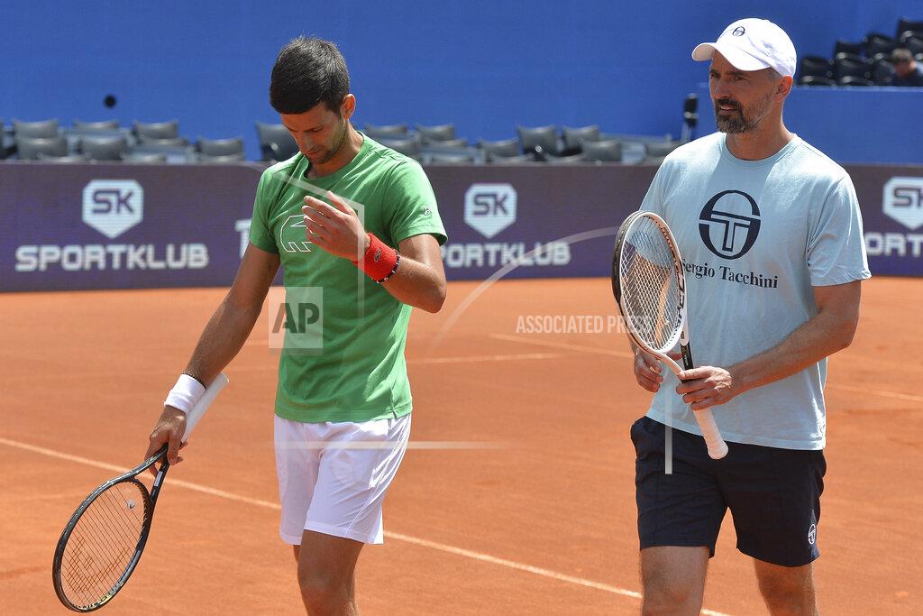 Zvonko Kucelin In this photo taken June 18, 2020, former Wimbledon champion Goran Ivanisevic, right, who now coaches top-ranked Novak Djokovic, right, attends a training session during an exhibition tournament in Zadar, Croatia. The Croatian great, who won his only Grand Slam title at the All England Club in 2001, wrote on Instagram that he tested positive for coronavirus after two negative tests in the last 10 days. (AP Photo/Zvonko Kucelin)