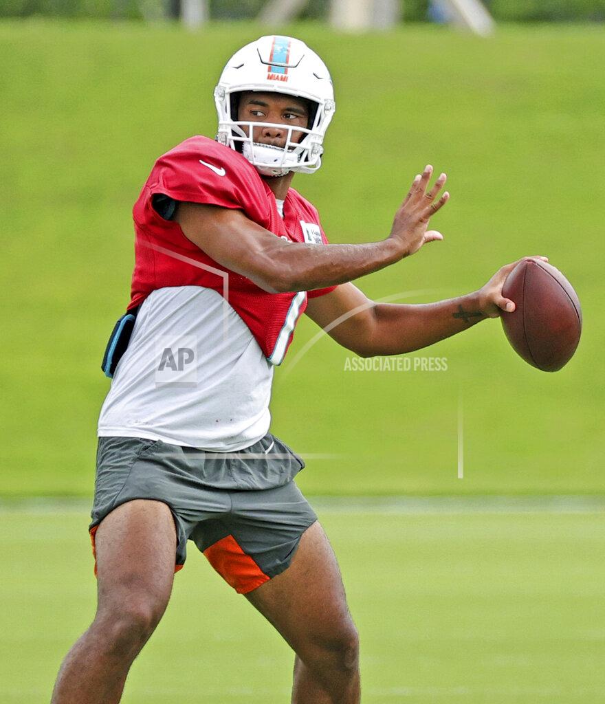 David Santiago Miami Dolphins quarterback Tua Tagovailoa (1) sets up to pass during practice at Baptist Health Training Complex in Hard Rock Stadium on Wednesday, October 13, 2021 in Miami Gardens, Florida, in preparation for their game against the Jacksonville Jaguars at Tottenham Hotspur Stadium in London on Sunday, October 17.(David Santiago/Miami Herald via AP)
