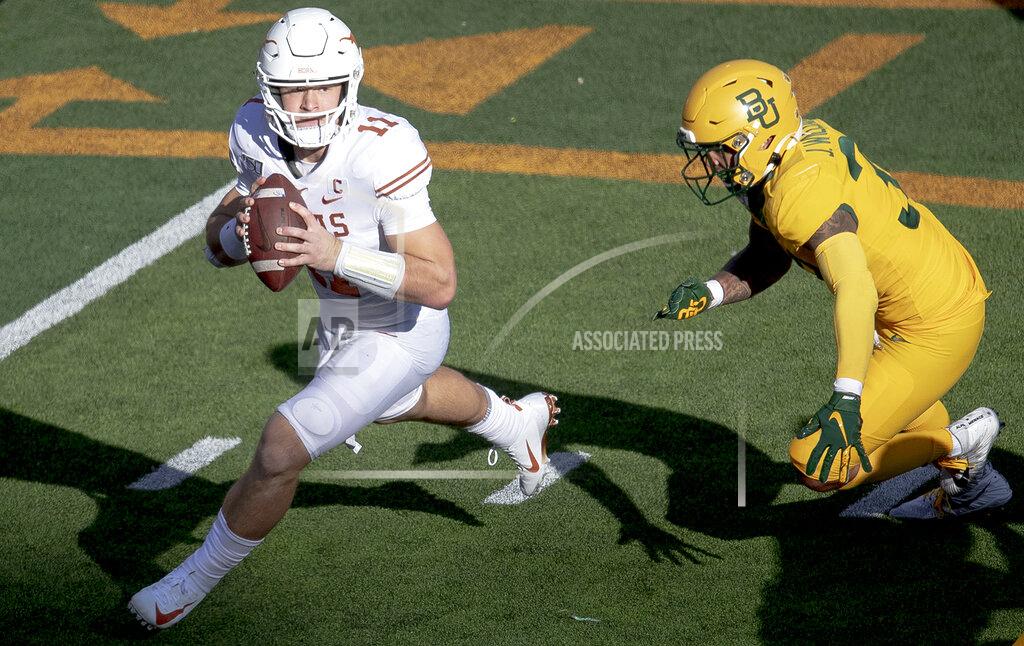 Nick Wagner Texas quarterback Sam Ehlinger (11) tries to evade Baylor linebacker Jordan Williams (38) during an NCAA college football game on Saturday, Nov. 23, 2019, in Waco, Texas. (Nick Wagner/Austin American-Statesman via AP)