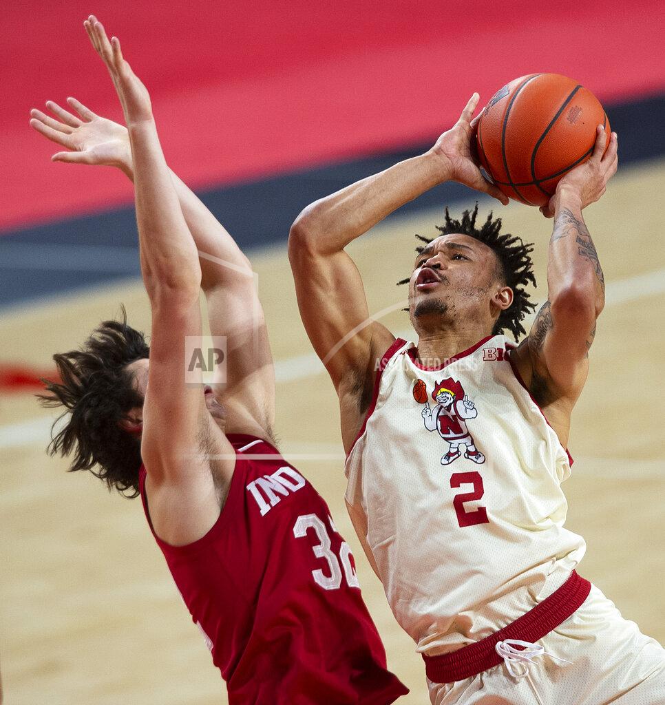 Kenneth Ferriera Nebraska's Trey McGowens scores against Indiana's Trey Galloway in the first half of an NCAA college basketball game on Sunday, Jan. 10, 2021. (Kenneth Ferriera/Lincoln Journal Star via AP)
