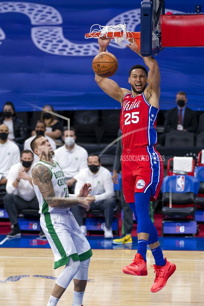 Chris Szagola Philadelphia 76ers' Ben Simmons, right, dunks the ball with Boston Celtics' Daniel Theis, left, watching on during the first half of an NBA basketball game, Friday, Jan. 22, 2021, in Philadelphia. (AP Photo/Chris Szagola)