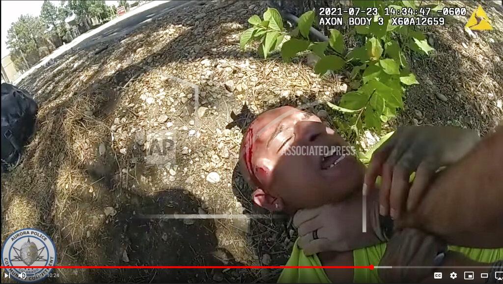 Uncredited EDS NOTE GRAPHIC CONTENT In this Friday, July 23, 2021, video image released by the Aurora Police Department shows police body camera footage of Aurora police officer using his pistol to beat a man he was trying to take into custody, choking him and threatening to kill him in Aurora, Colo.The Associated Press is not naming the man. He did not suffer serious injury but was taken to a hospital for welts and a cut on his head that required six stitches, police said. Authorities didn't say if he will face charges for an outstanding warrant on a probation violation. It is not clear what race or ethnicity he identifies as, but he appears in the video to be a person of color. (Aurora Police Department via AP)