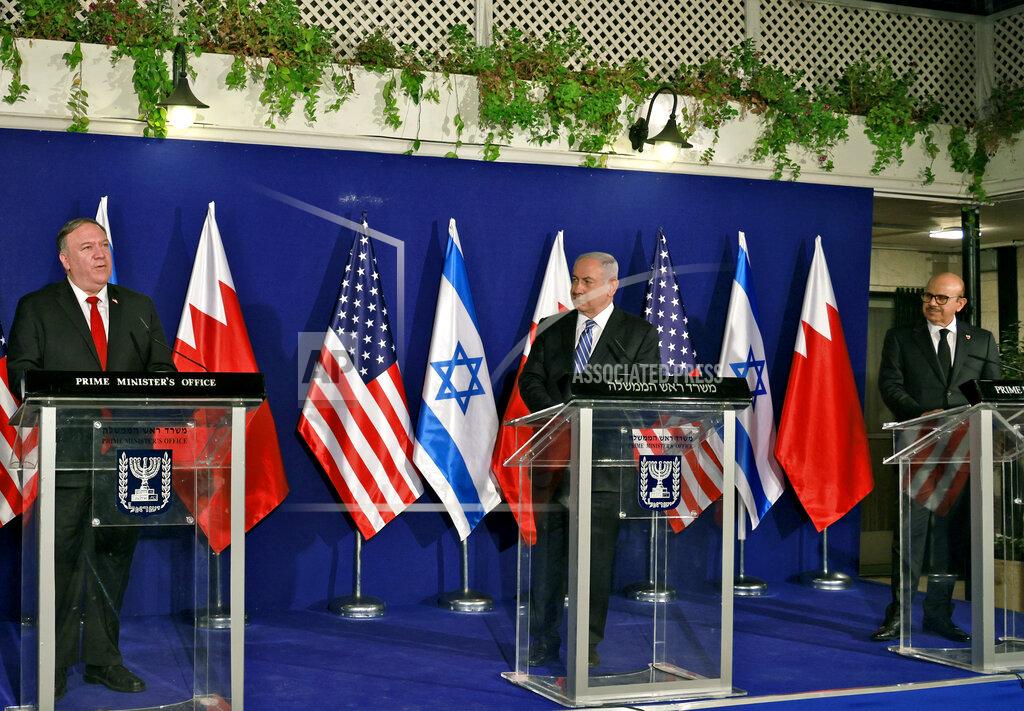 Menahem Kahana Israeli Prime Minister Benjamin Netanyahu, center, and Bahrain's Foreign Minister Abdullatif bin Rashid Alzayani, right, listen as U.S. Secretary of State Mike Pompeo speaks during a joint press conference after their trilateral meeting in Jerusalem on Wednesday, Nov. 18, 2020. (Menahem Kahana/Pool via AP)