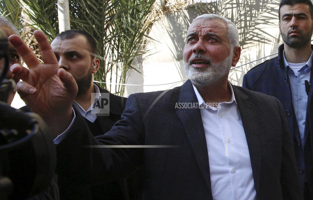 Adel Hana FILE - In this March 27, 2019 file photo, Hamas' supreme leader Ismail Haniyeh tours the site of a destroyed building, in Gaza City. Palestinian President Mahmoud Abbas has announced that the first presidential and parliamentary elections since 2006 will be held later in 2021. The voting is seen as a key step in mending a rift between Abbas’ Fatah party that rules the West Bank and the Islamic militant group Hamas that controls the Gaza Strip. ( (AP Photo/Adel Hana, File)