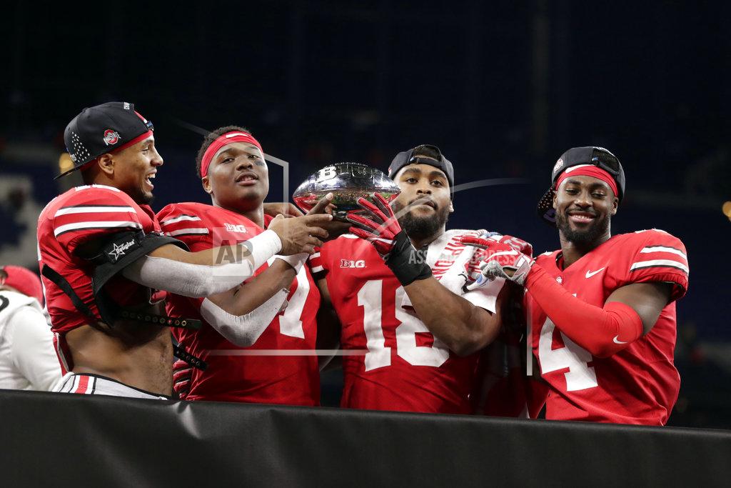 Michael Conroy Ohio State's Keandre Jones, Dwayne Haskins, Jonathon Cooper and Jordan Fuller, from left, celebrate early Sunday, Dec. 2, 2018 after defeating Northwestern 45-24 in the Big Ten championship NCAA college football game in Indianapolis. Ohio State won 45-24. (AP Photo/Michael Conroy)