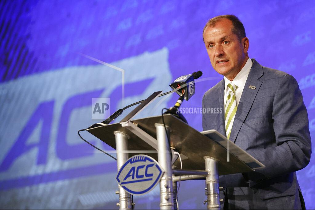 Nell Redmond Atlantic Coast Conference commissioner Jim Phillips speaks during an NCAA college football news conference at the ACC media days in Charlotte, N.C., Wednesday, July 20, 2022. (AP Photo/Nell Redmond)