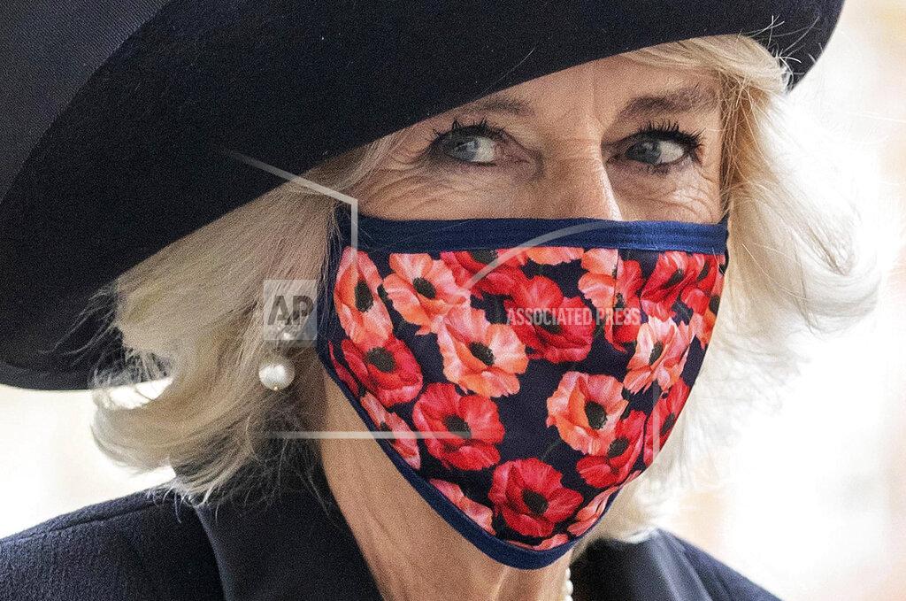 Aaron Chown Britain's Camilla Duchess of Cornwall leaves after attending the Armistice Day service at Westminster Abbey in London, Wednesday, Nov. 11, 2020. The specially arranged service, with social distancing because of the coronavirus, commemorates the 102nd anniversary of the armistice ending World War I, and one hundred years since the symbolic interment of the Unknown Warrior at Westminster Abbey. (Aaron Chown/Pool via AP)