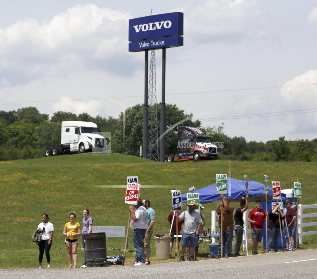 Matt Gentry FILE - In this June 18, 2021 file photo, UAW Members strike outside the Volvo Trucks North America plant in Dublin, Va. With Help Wanted signs at factories and businesses spreading across the nation, in manufacturing and in service industries, union workers like those at the Volvo site are seizing the opportunity to try to recover some of the bargaining power — and financial security — they feel they lost in recent decades as unions shrank in size and influence. (Matt Gentry/The Roanoke Times via AP)