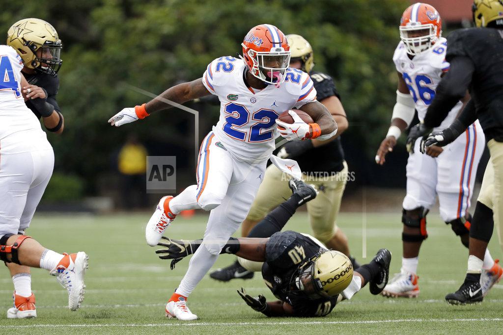 Mark Humphrey Florida running back Lamical Perine (22) gets past Vanderbilt linebacker Jordan Griffin (40) in the first half of an NCAA college football game Saturday, Oct. 13, 2018, in Nashville, Tenn. (AP Photo/Mark Humphrey)