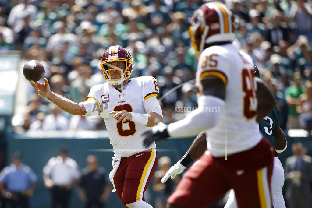 Matt Rourke Washington Redskins' Case Keenum, left, throws a touchdown pass to Vernon Davis during the first half of an NFL football game against the Philadelphia Eagles, Sunday, Sept. 8, 2019, in Philadelphia. (AP Photo/Matt Rourke)